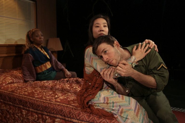 Cathy Simpson (rear left) as Jesus, Bi Jean Ngo and James Kern as daughter and father in Theatre Exile's production of 