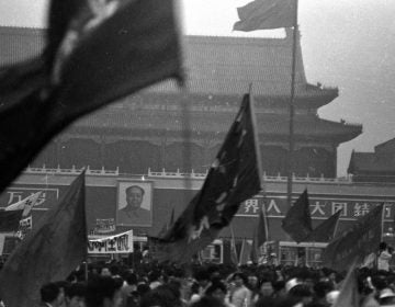 Protesters wave flags on Beijing's Tiananmen Square in the weeks leading up to the violent crackdowns on June 4. These photos were donated to Humanitarian China by the photographer, Jian Liu, then one of the student protesters. (Jian Liu/Humanitarian China)