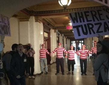 Members of the group March on Harrisburg dressed in Where's Waldo costumes in 2017, after their second march to the Capitol. They were arrested shortly after this demonstration — a common outcome for the group. (Katie Meyer/WITF)