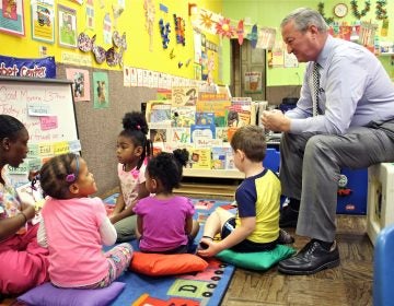 Philadelphia Mayor Jim Kenney sits in on a preschool class at Little Learners Literacy Academy in South Philadelphia in 2016. Pre-K expansion was one of Kenney's top campaign promises. (Emma Lee/WHYY)