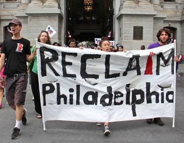 Members of Reclaim Philadelphia march through Center City prior to the Democratic National Convention in 2016 to demand that the DNC reveal its sources of funding.