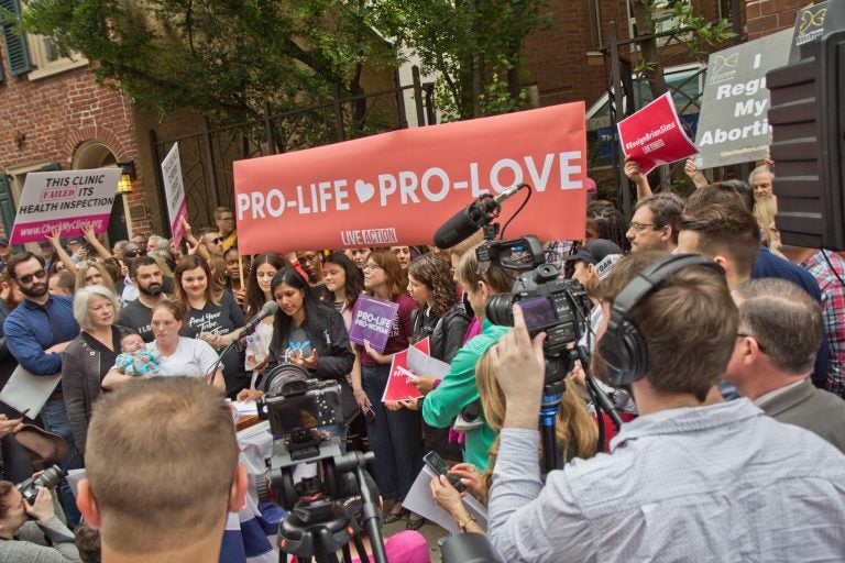 Protestors called for Representative Brian Sims to resign outside the Planned Parenthood Clinic on Locust Street in Center City Friday morning.(Kimberly Paynter/WHYY)