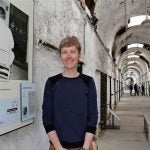 Annie Anderson, manager of research and public programming at Eastern State Penitentiary, has uncovered new information about LGBTQ prisoners and incorporated it into the attraction's audio tour.