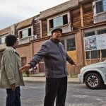Gerald Renfro and his wife Connie have stayed on the block despite many of their neighbors taking buyouts from the the city and are looking forward to more activity. (Kimberly Paynter/WHYY)