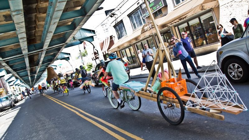 The 2019 Kensington Kinetic Sculpture Derby rides up Front Street. (Kimberly Paynter/WHYY)