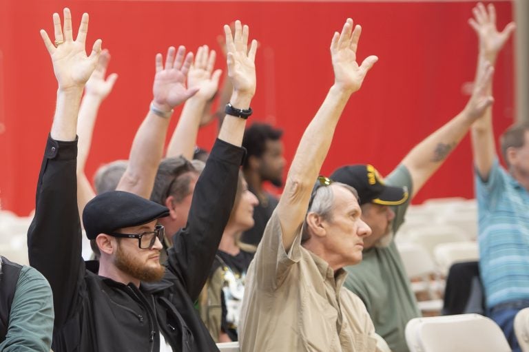 Lieutenance Governor John Fetterman asks the audience who is in favor of the legalization of recreational marijuana and the majority of attendees raise their hands. (Jonathan Wilson for WHYY)