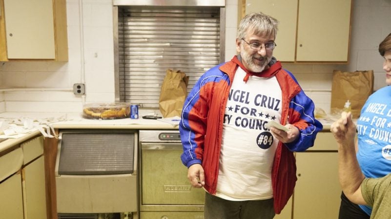 Charles Cappetti, a poll worker for the 2019 Philadelphia primary elections, collects pay after the polls close. Poll workers who work outdoors collect a same-day cash payment. (Natalie Piserchio for WHYY)