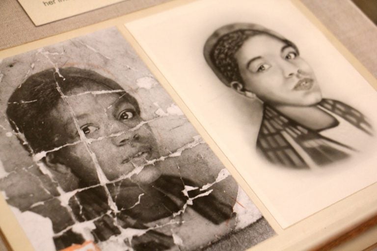 A photo of an unidentified young African American woman is deeply creased as if it were folded and carried around by someone  who valued it. It is part of an exhibit at the Library Company of Philadelphia called 