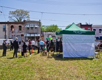 Philabundance employees and government officials ceremonially break ground at the site of a new community kitchen on north 10th Street. (Kimberly Paynter/WHYY)