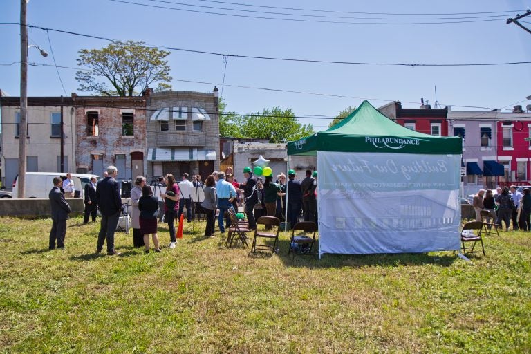 Philabundance employees and government officials ceremonially break ground at the site of a new community kitchen on north 10th Street. (Kimberly Paynter/WHYY)