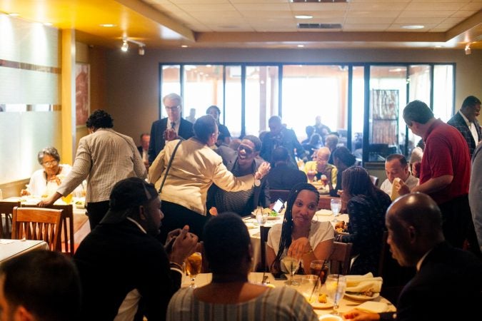 A packed dining room of local and state political influencers at Relish Tuesday afternoon during the 2019 primary election. (Brad Larrison for WHYY)
