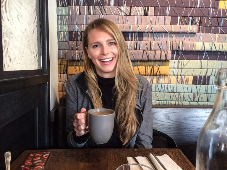 Janie Dumbleton was among the passengers of Amtrak 188 on May 12, 2015, when it derailed in Philadelphia, killing eight. She's shown here at High Street on Hudson, a restaurant in New York owned by another survivor of the crash, Eli Kulp. (Courtesy of Janie Dumbleton)