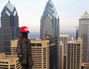 The Alexander Milne Calder statue of William Penn wears an All Star Game ball cap after it's installation early Friday morning, June 28, 1996, high over Philadelphia's City Hall. The 100-pound cap, 7 feet long and 4 feet high, was raised in preparation for the game to be played July 9. (AP Photo/ George Widman)