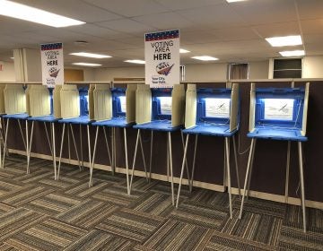 Voting booths stand ready in this Sept. 20, 2018 photo. Election officials and federal cybersecurity agents are touting improved collaboration aimed at confronting and deterring efforts to tamper with elections. (Steve Karnowski/AP Photo)