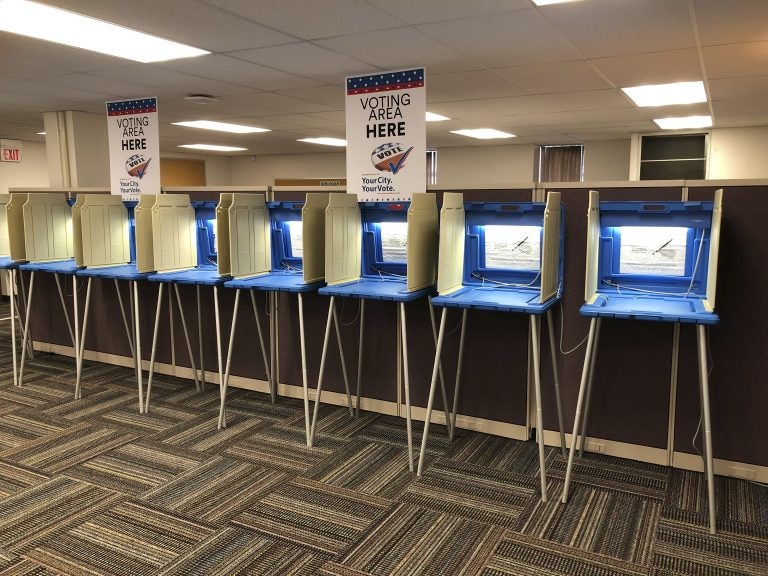 Voting booths stand ready in this Sept. 20, 2018 photo. Election officials and federal cybersecurity agents are touting improved collaboration aimed at confronting and deterring efforts to tamper with elections. (Steve Karnowski/AP Photo)