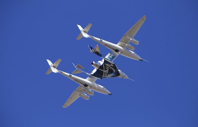 Virgin Galactic's VSS Unity rocket plane flown into the atmosphere before launching Friday, Feb. 22, 2019, in  Mojave, Calif. (Matt Hartman/AP Photo)