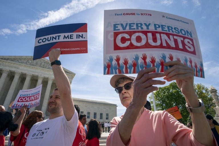 Immigration activists rally outside the Supreme Court as the justices hear arguments over the Trump administration's plan to ask about citizenship on the 2020 census. (J. Scott Applewhite/AP Photo)