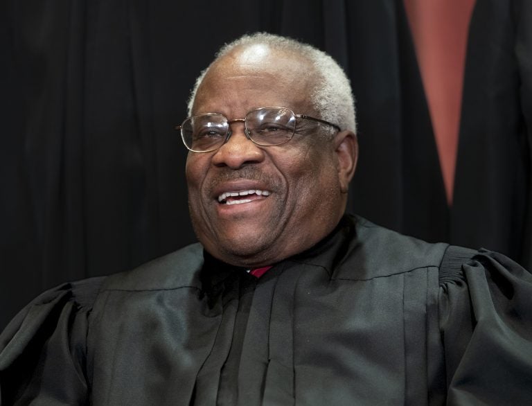 In this Nov. 30, 2018, file photo, Supreme Court Associate Justice Clarence Thomas, appointed by President George H. W. Bush, sits with fellow Supreme Court justices for a group portrait at the Supreme Court Building in Washington. Thomas is now the longest-serving member of a court that has recently gotten more conservative, putting him in a unique and potentially powerful position, and he’s said he isn’t going away anytime soon. (J. Scott Applewhite/AP Photo, File)