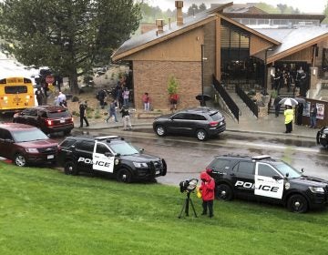 Police and others are seen outside STEM School Highlands Ranch, a charter middle school in the Denver suburb of Highlands Ranch, Colo., after a shooting Tuesday, May 7, 2019. Authorities said several people were injured and a few suspects were in custody. (David Zalubowski/AP Photo)
