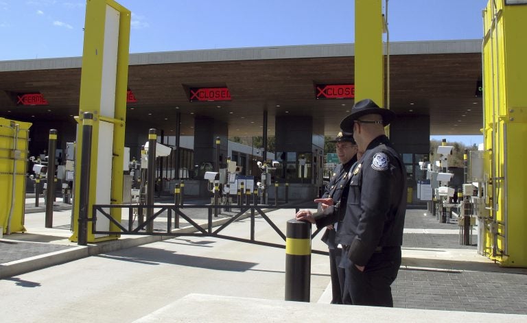 In this May 8, 2019 photo, U.S. Customs and Border Protection officials stand at the new border crossing facility on the U.S.-Canadian border in Derby Line, Vt. Some along the northern U.S. border are worried the temporary transfer of hundreds of border agents south could cause backups of people seeking to enter the United States from Canada during the busy summer tourist season. (Wilson Ring/AP Photo)