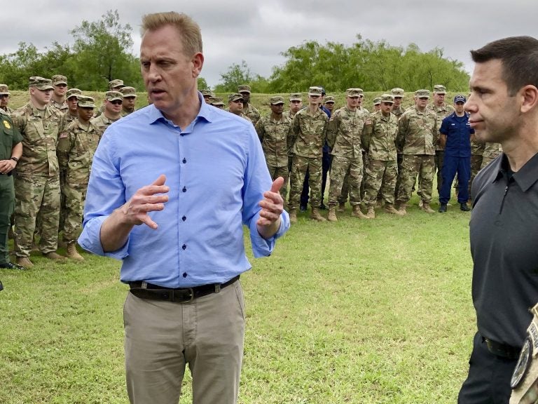 Acting Defense Secretary Patrick Shanahan, (left), speaks with troops near McAllen, Texas, about the military’s role in support of the Department of Homeland Security’s effort to secure the Southwest border. At right is Kevin McAleenan, acting DHS secretary. (Robert Burns/AP Photo)