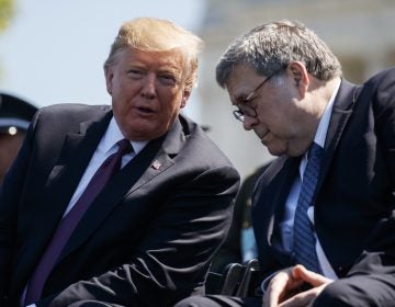 President Donald Trump talks with Attorney General William Barr during the 38th Annual National Peace Officers' Memorial Service at the U.S. Capitol, Wednesday, May 15, 2019, in Washington. (Evan Vucci/AP Photo)