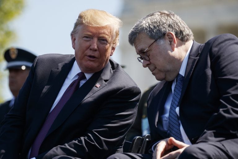 President Donald Trump talks with Attorney General William Barr during the 38th Annual National Peace Officers' Memorial Service at the U.S. Capitol, Wednesday, May 15, 2019, in Washington. (Evan Vucci/AP Photo)