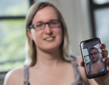 In this Wednesday, May 15, 2019, photo, Bailey Coffman shows her photo as a man in the Snapchat app during an interview in New York. Snapchat's new photo filter that allows users to change into a man or woman with the tap of a finger isn’t necessarily fun and games for transgender people. But some others see the potential for such tools to lead to self-discovery among people struggling with their gender identity. (Mary Altaffer/AP Photo)