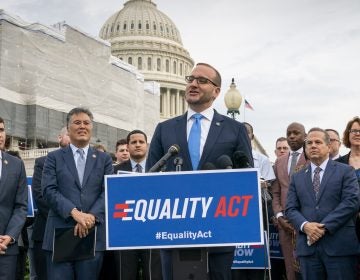 Chad Griffin, president of the Human Rights Campaign, flanked by Rep. Mark Takano, D-Calif., (left), and Rep. David Cicilline, D-R.I., speaks to advocates for LGBTQ rights as they rally before a vote in the House on the 'Equality Act of 2019,' sweeping anti-discrimination legislation that would extend civil rights protections to LGBT people by prohibiting discrimination based on sexual orientation or gender identity, at the Capitol in Washington, Friday, May 17, 2019. Cicilline is the chief sponsor of the bill to protect LGBTQ rights. (J. Scott Applewhite/AP Photo)