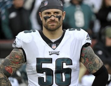 In this Dec. 30, 2018, file photo, Philadelphia Eagles defensive end Chris Long stands on the sideline prior to the team's NFL football game against the Washington Redskins in Landover, Md. Long has announced his retirement from football, ending an 11-year NFL playing career that included winning two Super Bowl titles and the Walter Payton Man of the Year Award. (Mark Tenally/AP Photo)