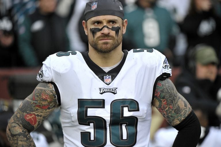 In this Dec. 30, 2018, file photo, Philadelphia Eagles defensive end Chris Long stands on the sideline prior to the team's NFL football game against the Washington Redskins in Landover, Md. Long has announced his retirement from football, ending an 11-year NFL playing career that included winning two Super Bowl titles and the Walter Payton Man of the Year Award. (Mark Tenally/AP Photo)