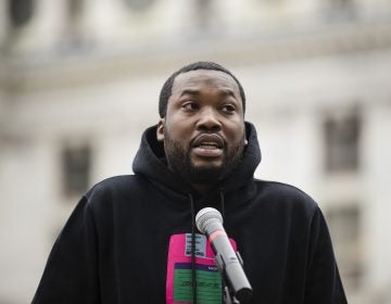 In this April 2, 2019, file photo, rapper Meek Mill speaks at a gathering in Philadelphia to push for drastic changes to Pennsylvania's probation system. Philadelphia's District Attorney's office wants a new trial with a new judge for rapper Meek Mill. Larry Krasner submitted the brief Wednesday, May 22, 2019. (Matt Rourke/AP Photo)