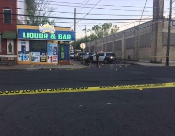 This photo provided by 3 CBS Philadelphia shows police canvasing the scene of a shooting in Trenton, N.J. on Saturday, May 25, 2019.  New Jersey police say 10 people have been wounded following a shooting at a Trenton bar.  Trenton police spokesman Capt. Stephen Varn said five men and five women were transported to local hospitals. He said one victim was critically wounded and taken into emergency surgery.  (3 CBS Philadelphia via AP)