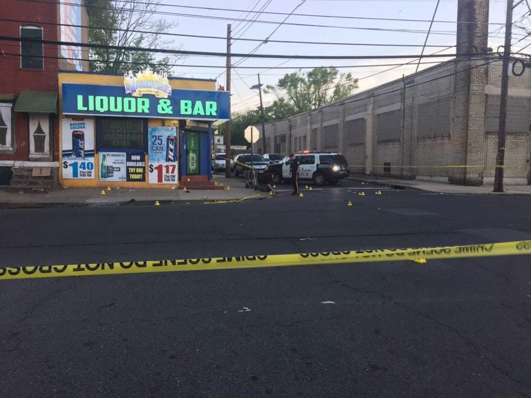 This photo provided by 3 CBS Philadelphia shows police canvasing the scene of a shooting in Trenton, N.J. on Saturday, May 25, 2019.  New Jersey police say 10 people have been wounded following a shooting at a Trenton bar.  Trenton police spokesman Capt. Stephen Varn said five men and five women were transported to local hospitals. He said one victim was critically wounded and taken into emergency surgery.  (3 CBS Philadelphia via AP)