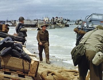 Landing craft on the beach during D-Day on June 6, 1944 in France. Seventy-five years later, surprising color images of the D-Day invasion and aftermath bring an immediacy to wartime memories. They were filmed by Hollywood director George Stevens and rediscovered years after his death. (War Footage from the George Stevens Collection at the Library of Congress via AP)