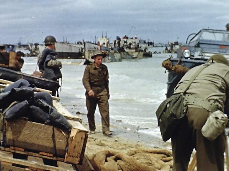 Landing craft on the beach during D-Day on June 6, 1944 in France. Seventy-five years later, surprising color images of the D-Day invasion and aftermath bring an immediacy to wartime memories. They were filmed by Hollywood director George Stevens and rediscovered years after his death. (War Footage from the George Stevens Collection at the Library of Congress via AP)
