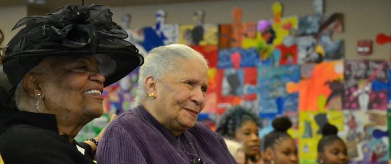 Bertha Garnett, center, listens to speakers at an event honoring her son, Reuben Garnett Jr., who was killed in action in Vietnam. At left is her daughter, India Garnett, who worked for decades to have her brother's service honored. Bertha's great-granddaughters Courtney, Tianna and Sheniah can be seen in the background. (Brett Sholtis/WITF)