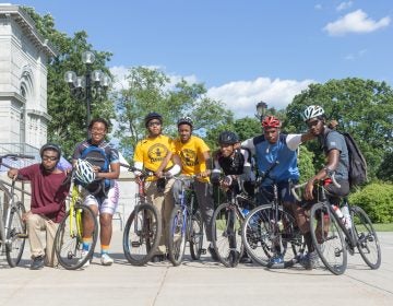 Members of the National Youth Bike Council pose at the Please Touch Museum before a group ride through Fairmount Park. (Angela Gervasi for WHYY)