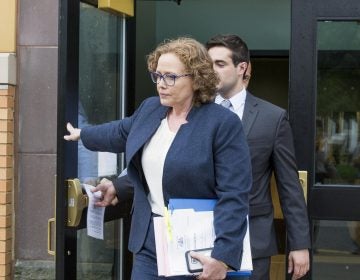 Karen Muir, (front), Becker's attorney, walked out of the Centre County Courthouse on Thursday, after the jury rendered a verdict for Becker. (Min Xian/WPSU)