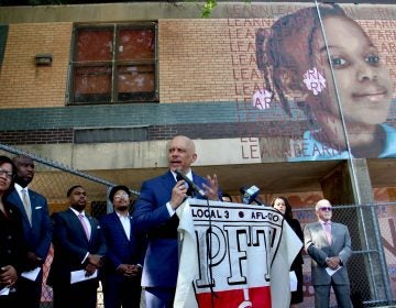 State Sen. Vincent Hughes announces proposed legislation that would allocate surplus state funds to emergency school repairs, largely in Philadelphia. (Emma Lee/WHYY)