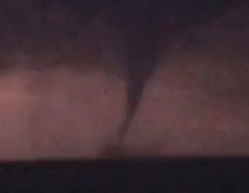 Bonanza II crew member James Dawson captured this image of a waterspout in the Delaware Bay off Cumberland County Tuesday evening. The waterspout is illuminated by lightning. (Image courtesy of Bonanza II)