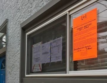 A notice deems the property at 1365 Palmer St. 'imminently dangerous' (Michaela Winberg/Billy Penn)