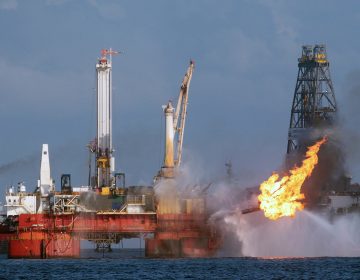 The Deepwater Horizon oil rig is seen here in July 2010, shortly before the Macondo well was capped after spilling oil for 87 days. The Trump administration has proposed revisions to Obama-era rules that aimed to prevent similar disasters. (Dave Martin/Associated Press)