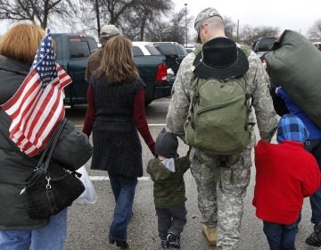 In this Dec. 24, 2011 file photo, a soldier walks with his family following a ceremony at Fort Hood, Texas, for soldiers from the U.S. Army 1st Cavalry 3rd Brigade, who returned home from deployment in Iraq. (Erich Schlegel/AP)