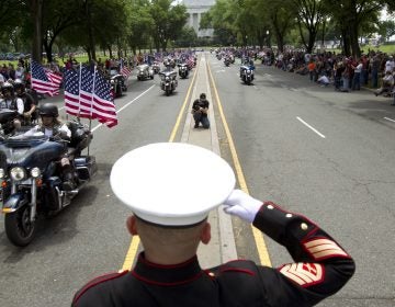 U.S. Marine Tim Chambers salutes to participants in last year's Rolling Thunder motorcycle demonstration. (Jose Luis Magana/AP)