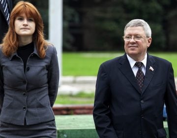 Maria Butina with mentor Alexander Torshin, then a member of Russia's upper house of parliament, in Moscow in 2012. The two sought political influence in the United States. (Pavel Ptitsin/AP)