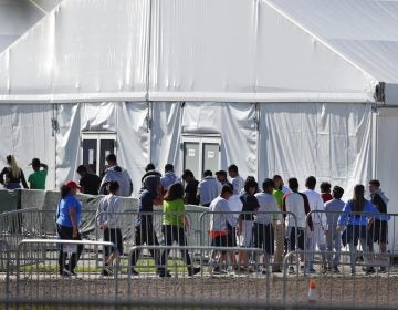 Children line up to enter a tent at the Homestead Temporary Shelter for Unaccompanied Children in Homestead, Fla., in February. (Wilfredo Lee/AP)