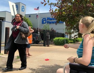 Teresa Pettis (right), an abortion opponent, protests outside the Planned Parenthood clinic in St. Louis, on May 17. Unless a judge intervenes, health officials will force a Missouri facility to stop offering the procedure this week. (Jim Salter/AP)