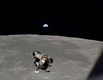 The Apollo 11 Lunar Module ascent stage in lunar orbit in 1969 with with astronauts Neil Armstrong and Buzz Aldrin aboard. The Earth rises above the lunar horizon. (Photo credit: NASA)
