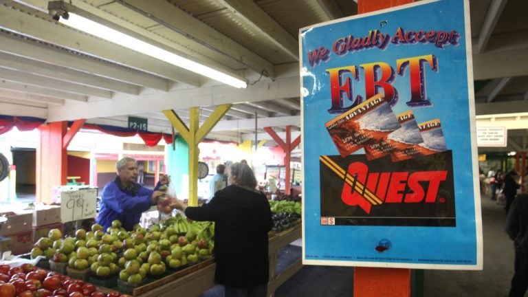 A sign announces the acceptance of electronic benefit transfer cards at a farmers market in California. (Rich Pedroncelli/AP)